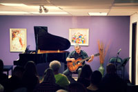 Adult student performing guitar